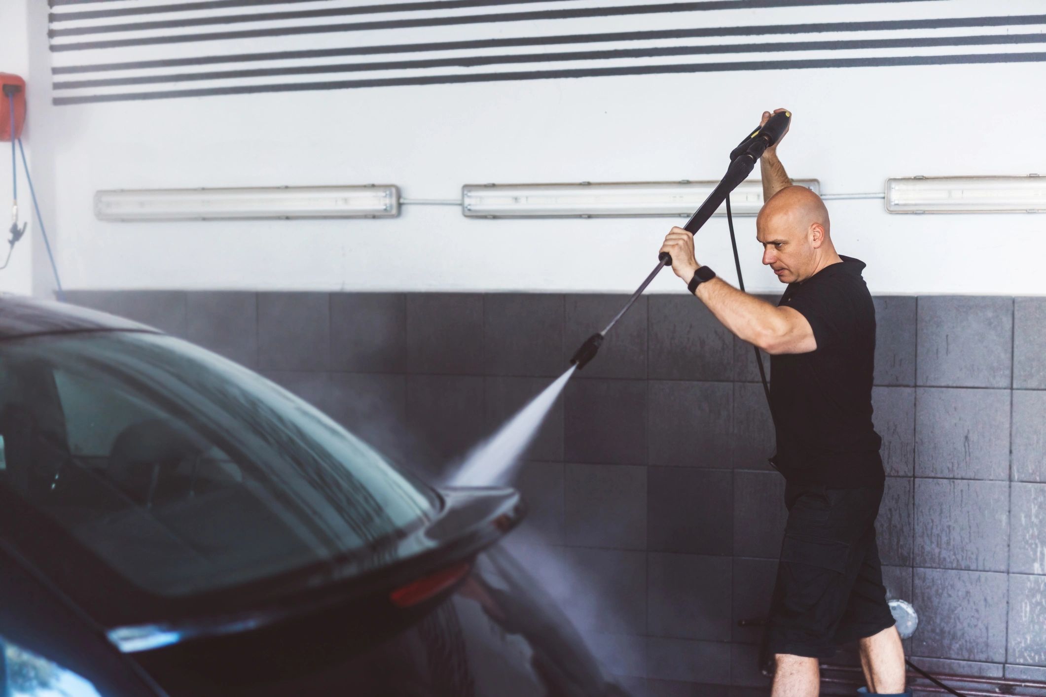 Pressure washing a company vehicle for fleet cleaning service